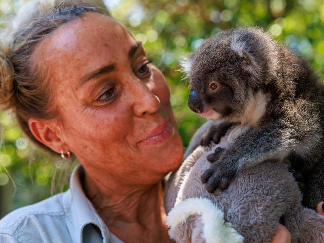 Vet nurse and keeper Annii Downing with koala joey Gracie also known as Gizmo, who she is hand rearing, at Taronga Zoo. Picture: Justin Lloyd.