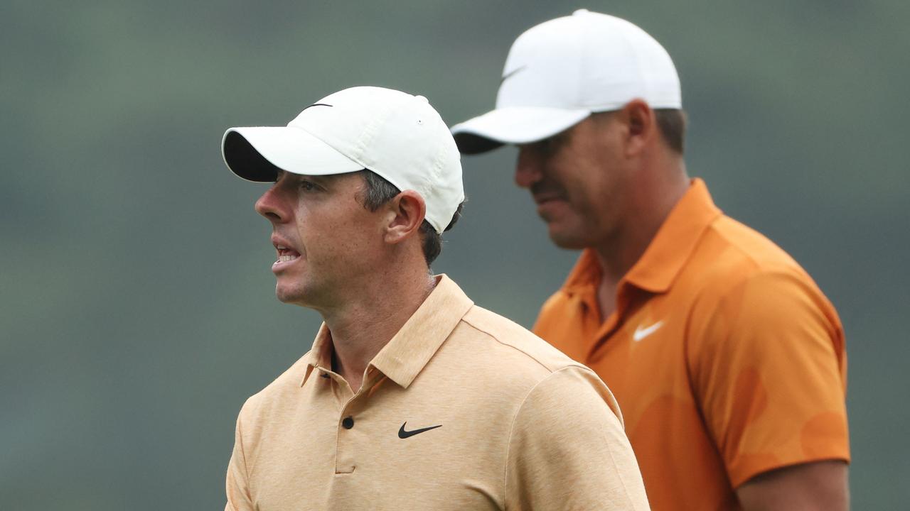 (FILES) Rory McIlroy, of Northern Ireland, and Brooks Koepka, of the United States, walk to the fourth tee during a practice round prior to the 2023 Masters Tournament at Augusta National Golf Club in Augusta, Georgia, on April 04, 2023. Rory McIlroy said on May 31, 2023, that LIV Golf star Brooks Koepka has earned the right to a place on the United States' Ryder Cup team following his PGA Championship triumph. Koepka bagged his fifth major title at the PGA Championship earlier this month, just weeks after a second-place finish at the Masters. (Photo by Patrick Smith / GETTY IMAGES NORTH AMERICA / AFP)