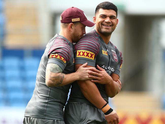 Cameron Munster gets physical with David Fifita during a Queensland Maroons State of Origin training session at Cbus Super Stadium. Picture: Chris Hyde/Getty Images