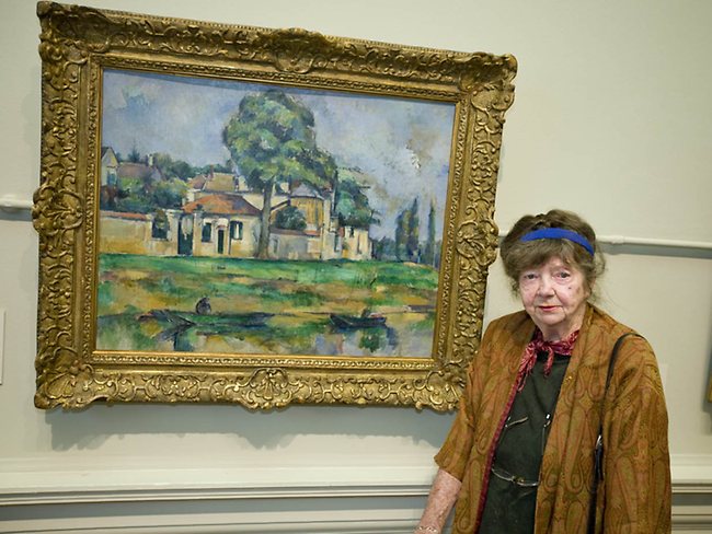 <p>Artist Margaret Olley stands in front of the new Paul Cezanne painting she helped the Art Gallery of NSW acquire in 2008. Olley dontated $1 million towards the purchase of the painting by the French impressionist entitled 'Bords de la Marne' c1888. Picture: Charlie Brewer</p>