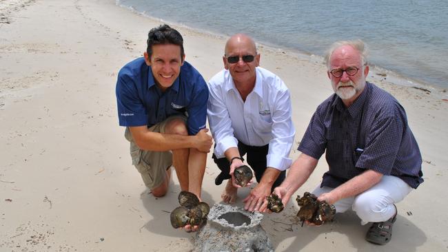 Ben Diggles (Digfish Services), former Cr Gary Parsons and Rob King (Sunfish) at Sandstone Point with shellfish and an artificial “reef ball”, which Shellfish grow on. Photo supplied.