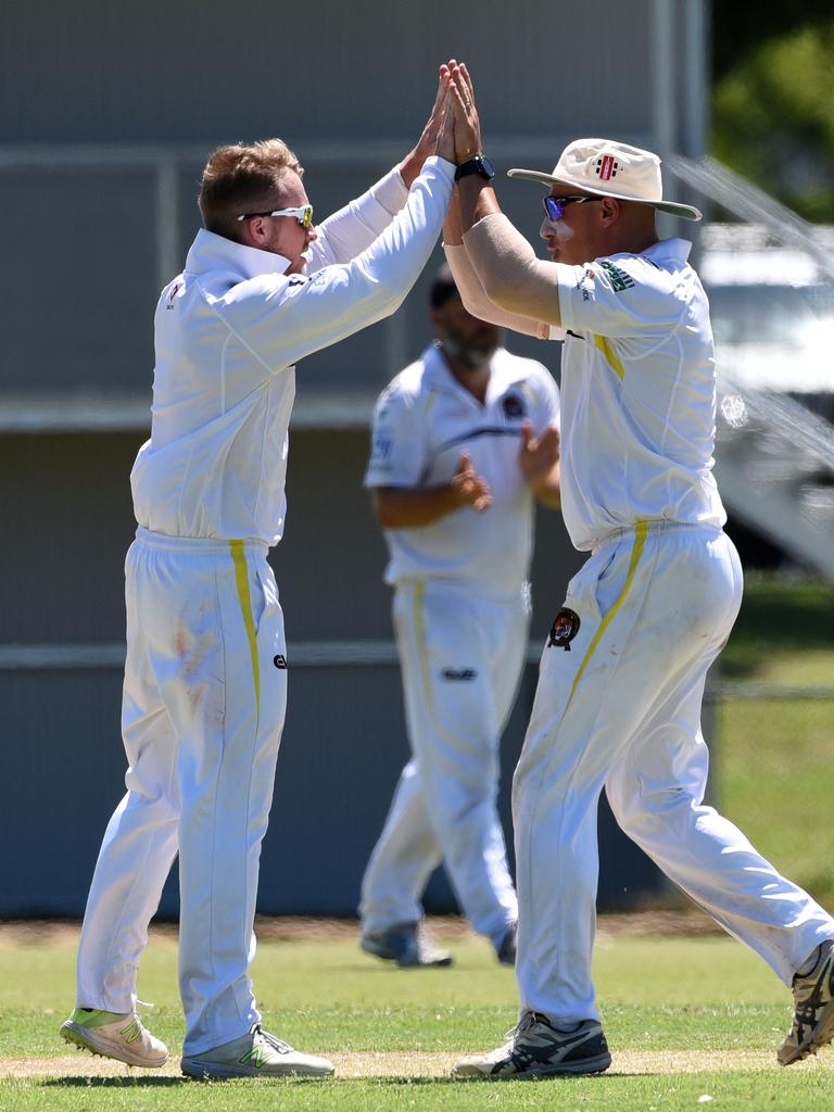 Matty Morris (left) celebrates taking the wicket of Aaron Densley. Picture: Steve Holland