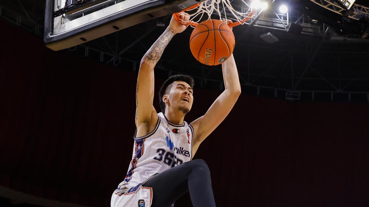 Kai Sotto slam dunks during the win against Sydney. Picture: Jenny Evans/Getty Images