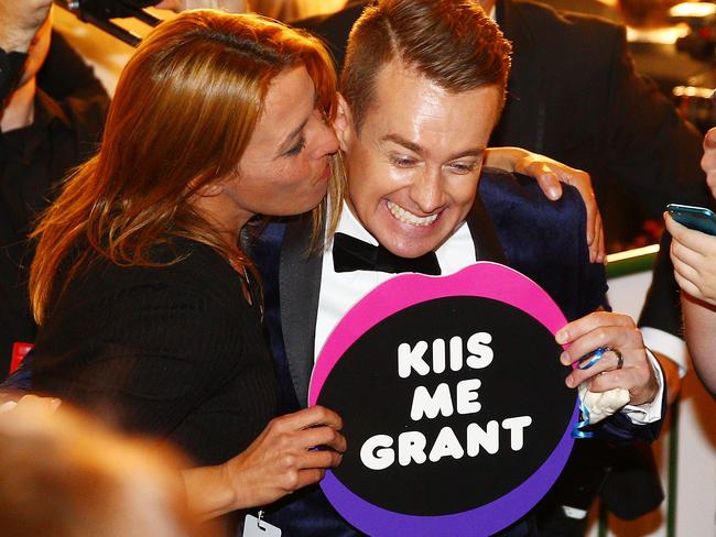 Grant Denyer is kissed by a supporter in the audience as he arrives at the 58th Annual Logie Awards at Crown Palladium on May 8, 2016 in Melbourne, Australia. Picture: Scott Barbour/Getty Images