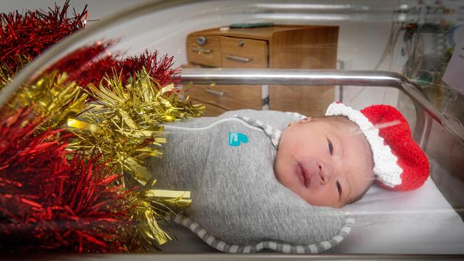 Baby Ella was a nice Christmas surprise for her parents Michelle Lam and Andy Yiu. Picture: Mark Stewart