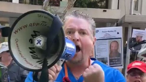 William Bay during a protest outside of AHPRA's Brisbane office, where he was subsequently arrested by police and charged with contravening a direction. Picture: Supplied / Twitter