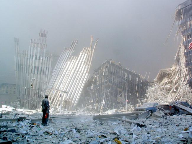 A man stands in the rubble, and calls out asking if anyone needs help, after the collapse of the first of the twin towers of the World Trade Centre Tower in lower Manhattan. Picture: AFP