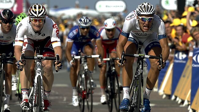 Germany's Marcel Kittel (R) reacts as he crosses the finish line ahead of Germany's Andre Greipel (2ndL) at the end of the 197 km tenth stage.