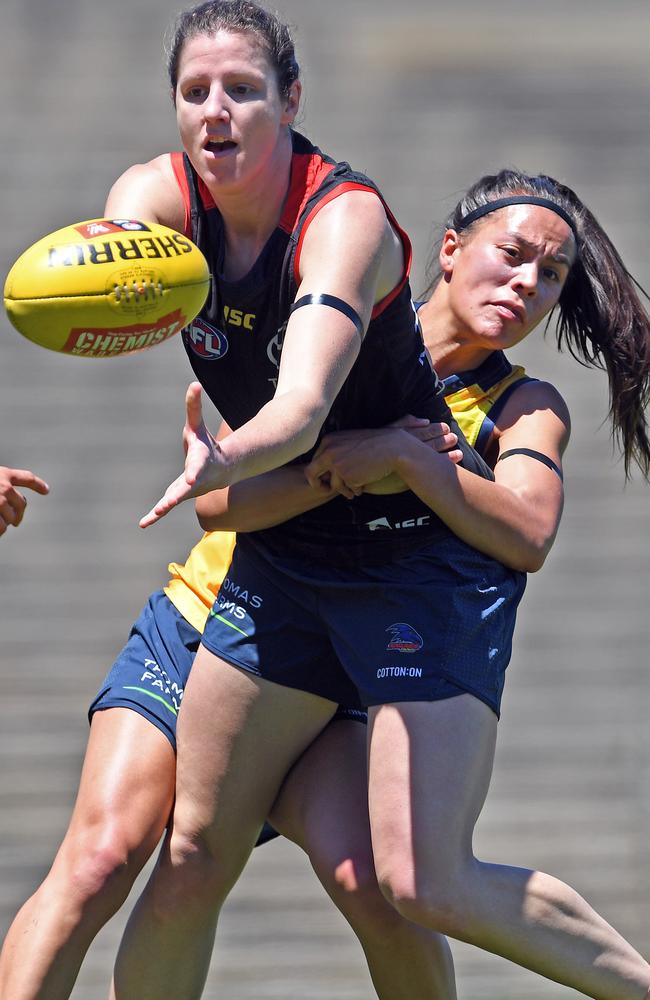 Adelaide Crows AFLW draftee Jess Foley tacked by Justine Mules. Picture: TOM HUNTLEY