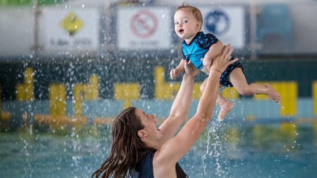 Nicole Martin and her 10-month-old son Archie splash around at Melton Waves public pool. Picture: Jake Nowakowski