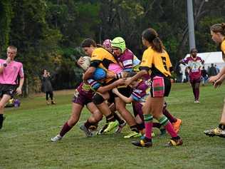 HARD HIT: Pania Cash from the Outback Queensland rugby league side goes in hard for the tackle. Picture: Hineata Cash