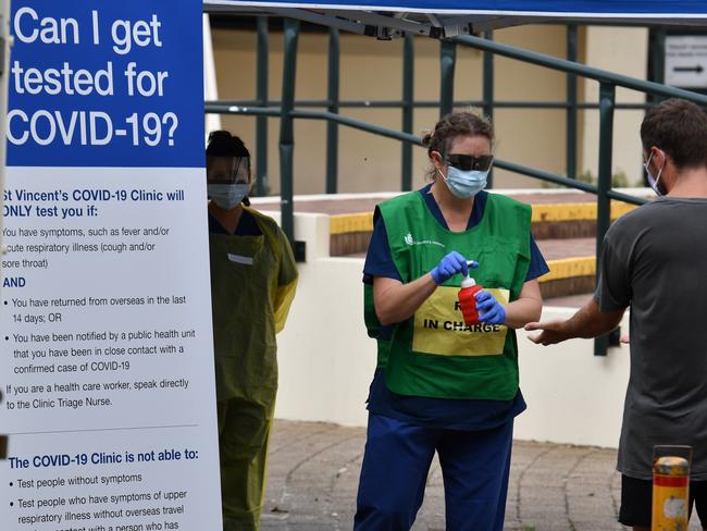 Nursing staff from St. Vincent’s Hospital see local residents and backpackers at a COVID-19 testing clinic. Picture: AAP Image/Dean Lewins