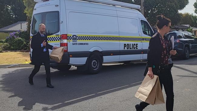 Detectives remove evidence from the scene of an alleged murder in Wark Court, Morphett Vale. Picture: Dasha Havrilenko