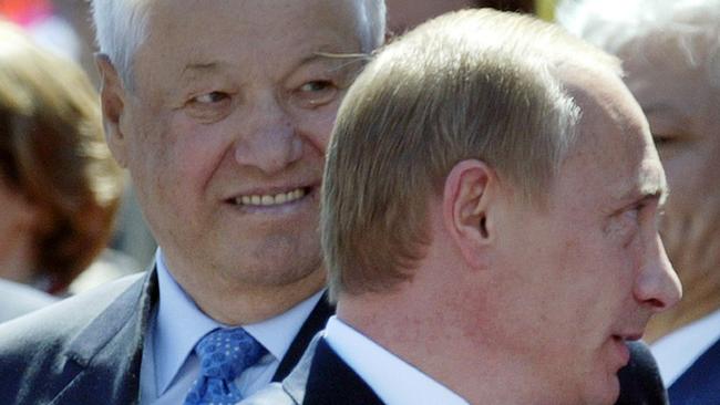 Russian President Vladimir Putin and the former Russian president Boris Yeltsin during a parade at the Red Square in Moscow. Picture: AFP