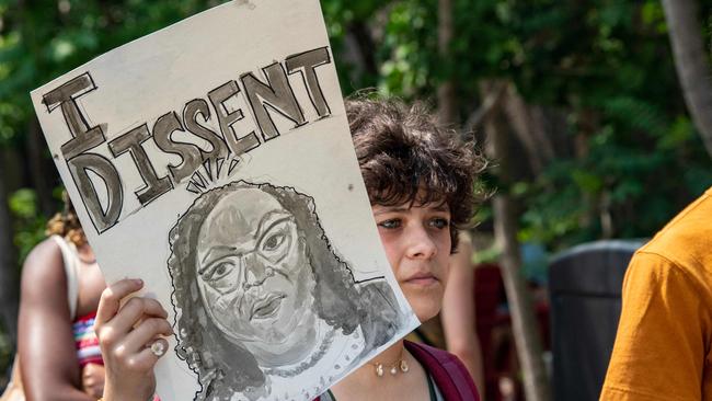 A proponent of affirmative action holds a sign during a protest at Harvard University in Cambridge, Massachusetts.