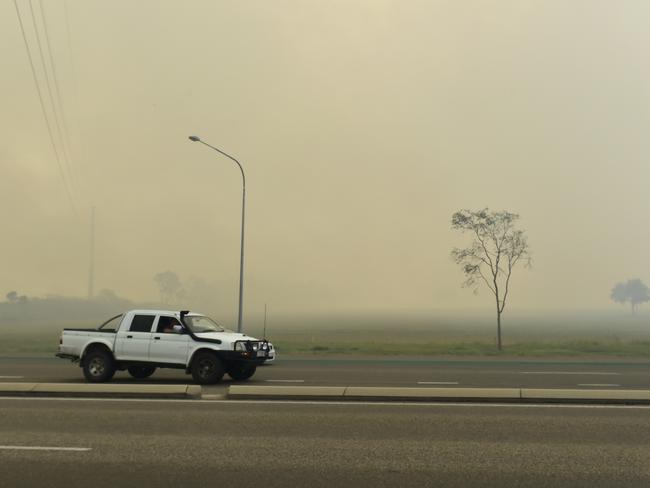 A fire burning south of Townsville has masked the Bruce Highway (PICTURED) in smoke. The vegetation fire started near the JBS Meatworks at Stuart. PICTURE: MATT TAYLOR.
