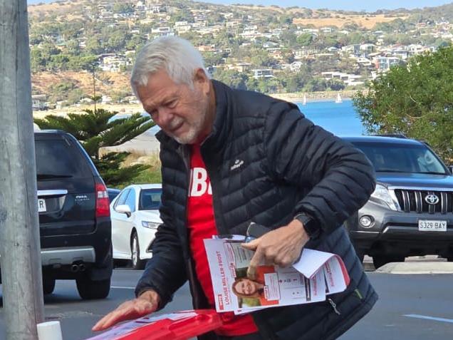 Video has emerged of a Labor volunteer ripping down an election poster at a Boothby polling booth.