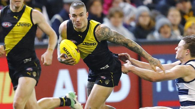 AFL 2nd Qualifying Final. Geelong v Richmond at the MCG . Richmonds Dustin Martin slips the tackle of Geelong's Mitch Duncan  . Pic: Michael Klein