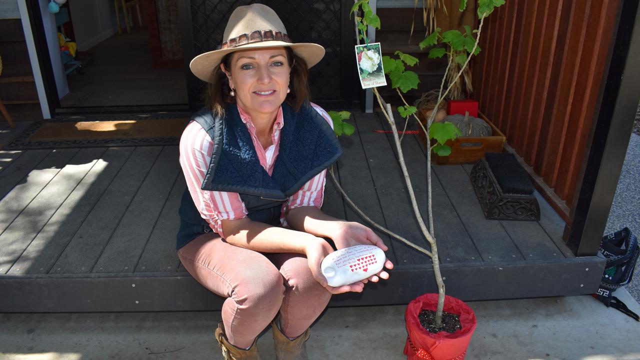 SPECIAL TRIBUTE: Owners of one of the two roosters who survived a recent dog attack at Splitters Farm, gifted Carly Clark (pictured) a painted memorial stone and Hibiscus Sharon tree, to pay tribute to the animals that were recently lost. Picture: Rhylea Millar.