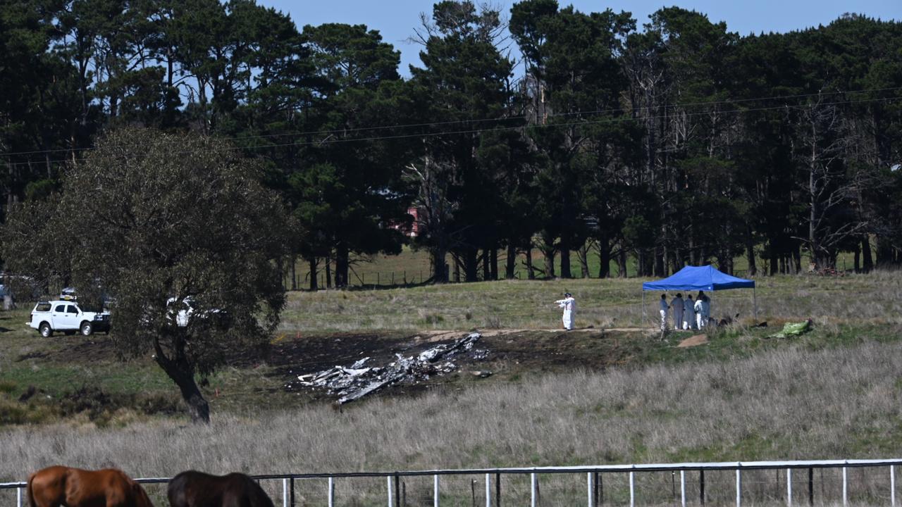 Investigators are combing through the smouldering wreck of a plane that crashed near Canberra, killing a grandfather and his three children on board. Picture: NCA NewsWire/ Martin Ollman