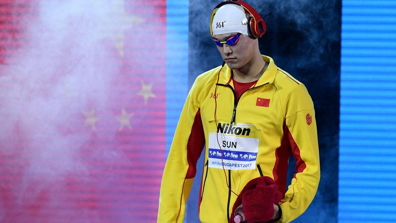 (FILES) In this file photo taken on July 23, 2017 China's Sun Yang arrives to compete in the men's 400m freestyle final during the swimming competition at the 2017 FINA World Championships in Budapest. - Chinese swimmer Sun Yang will miss the Tokyo Olympics after the Court of Arbitration for Sport increased his ban for doping charges on June 22, 2021. CAS ruled that Sun be suspended for four years and three months starting on February 28, 2020. (Photo by Martin BUREAU / AFP)