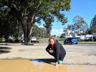 MUDDY WATERS: Juliet Gold is one of many who are fed up with poor car park conditions at the One Mile complex. Picture: Josh Preston