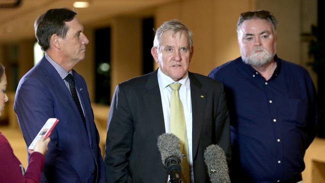 Minister for Natural Resources and Mines Anthony Lynham with QRC chief Ian Macfarlane and AWU organiser Mark Raguse. Picture: AAP Image/Steve Pohlner