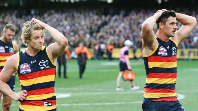 Rory Sloane and Taylor Walker of the Crows after defeat during the 2017 Grand Final