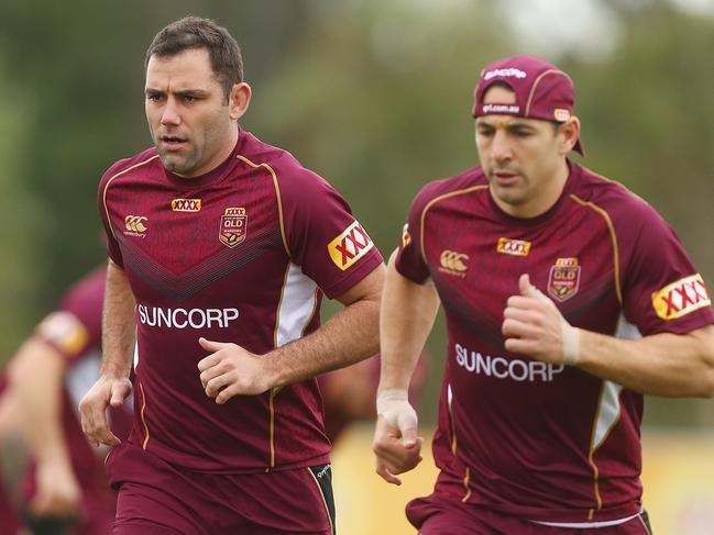 Cameron Smith (L) was an onfield coach for the Storm and Maroons. Picture: Chris Hyde/Getty Images