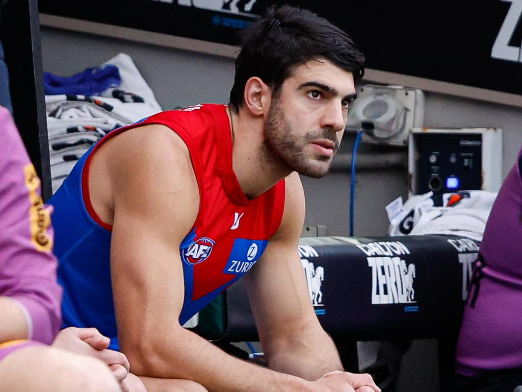 MELBOURNE, AUSTRALIA - JUNE 10: Christian Petracca of the Demons is seen on the bench after leaving the ground with a rib injury during the 2024 AFL Round 13 match between the Collingwood Magpies and the Melbourne Demons at The Melbourne Cricket Ground on June 10, 2024 in Melbourne, Australia. (Photo by Dylan Burns/AFL Photos via Getty Images)