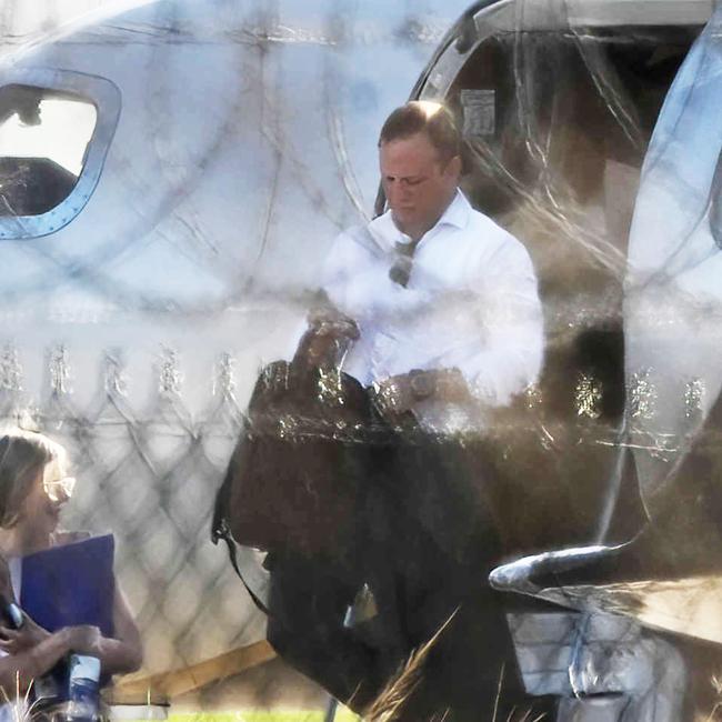 Premier Steven Miles and staff exit the jet at Brisbane Airport. Picture: Lyndon Mechielsen/Courier Mail