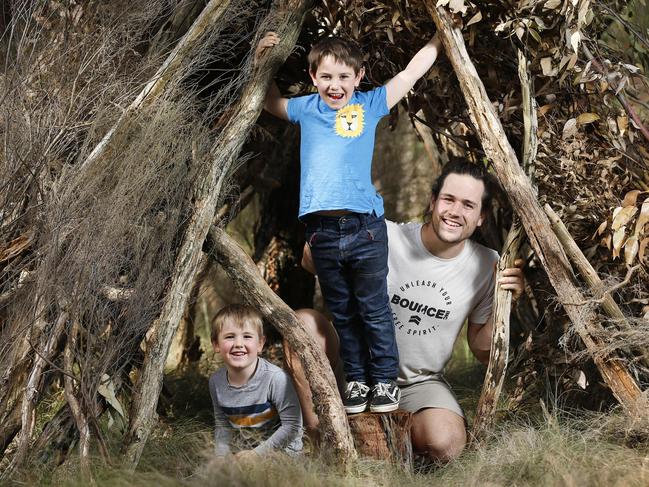 Families are worried about the death of the school camp in Victoria. The government is refusing to give any information, putting at risk school camp sites which may be forced to sell if they get no bookings. Tom Holley with sons Caleb 4 and Eli 7 build a hideout in the bush like being on camp on their Mount Helen property.   Picture: David Caird