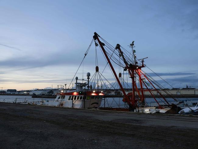 This photograph, taken in Le Havre, northern France, on October 30, 2021, shows the trawler 'Cornelis-Gert Jan Dumfries', which is docked in the northern French port of Le Havre as it waits to be given permission to leave. - Britain, on October 29, 2021, warned it may implement new checks on European Union fishing boats if France carries out its threats of retaliatory measures in a deepening row over post-Brexit access to waters. French President Emmanuel Macron said that Britain's "credibility" was on the line in the dispute, accusing London of ignoring the Brexit deal agreed after years of tortuous negotiations. (Photo by Sameer Al-DOUMY / AFP)