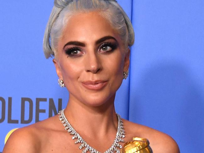 Winner for Best Original Song - Motion Picture for "Shallow - A Star is Born" Lady Gaga poses with the trophy during the 76th annual Golden Globe Awards on January 6, 2019, at the Beverly Hilton hotel in Beverly Hills, California. (Photo by Mark RALSTON / AFP)