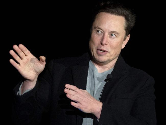 (FILES) In this file photo taken on February 10, 2022 Elon Musk gestures as he speaks during a press conference at SpaceX's Starbase facility near Boca Chica Village in South Texas. - Twitter suspended December 15, 2022, the accounts of more than a half-dozen journalists who had been writing about the company and its new owner Elon Musk. Some of the journalists had been tweeting about Twitter shutting down an @ElonJet account that tracked flights of the billionaire's private jet and about versions of that account hosted at other social networks. (Photo by JIM WATSON / AFP)