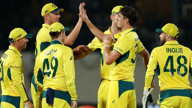 DHARAMSALA, INDIA - OCTOBER 28: Pat Cummins of Australia celebrates with teammates after taking the wicket of Matt Henry of New Zealand (not pictured) during the ICC Men's Cricket World Cup India 2023 Group Stage Match between Australia and New Zealand at HPCA Stadium on October 28, 2023 in Dharamsala, India. (Photo by Robert Cianflone/Getty Images)