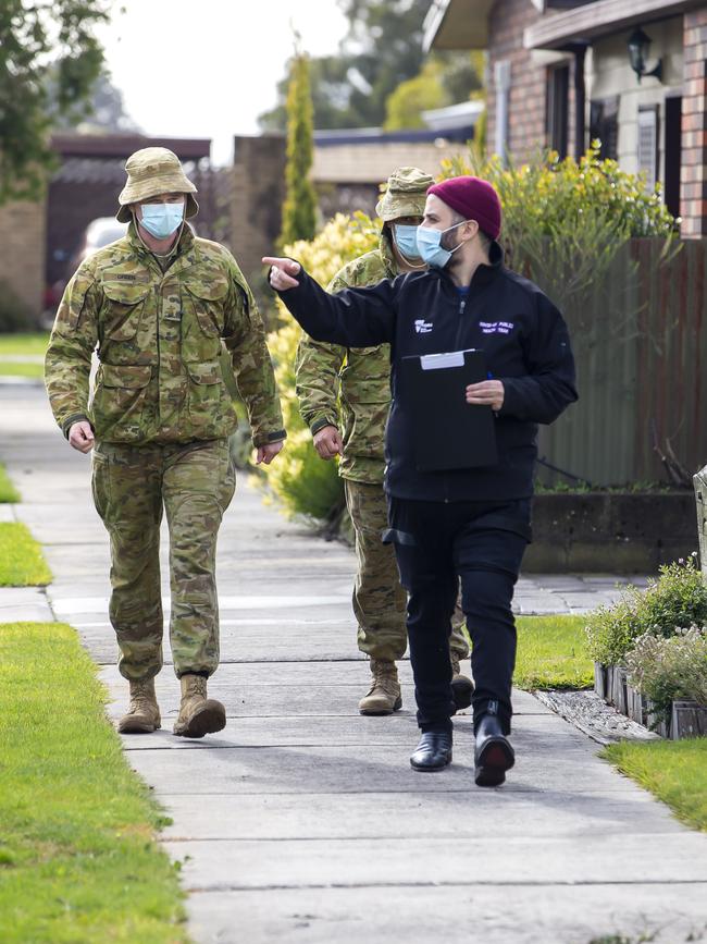 Australian Army soldiers door knocking in Victoria, during a testing blitz last year. Picture: Supplied