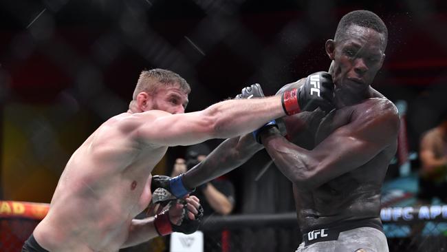 LAS VEGAS, NEVADA – MARCH 06: (L-R) Jan Blachowicz of Poland punches Israel Adesanya of Nigeria in their UFC light heavyweight championship fight during the UFC 259 event at UFC APEX on March 06, 2021 in Las Vegas, Nevada. (Photo by Chris Unger/Zuffa LLC)