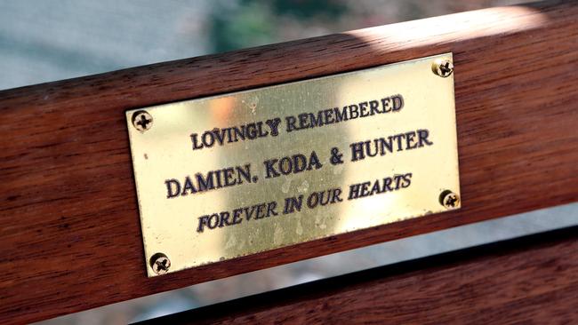 Remembering: A dedication on a bench in the back yard of Damien's parents’ home. Picture: News Corp