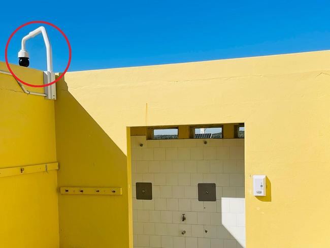 Locals who frequent a public change room near a popular beach have raised concerns over a suspiciously located surveillance camera.