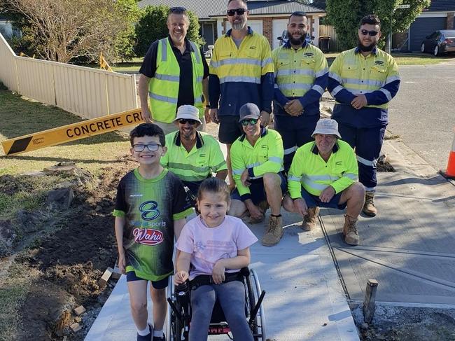 Leah Raish and the construction crew after the pavement was built. Picture: Supplied.