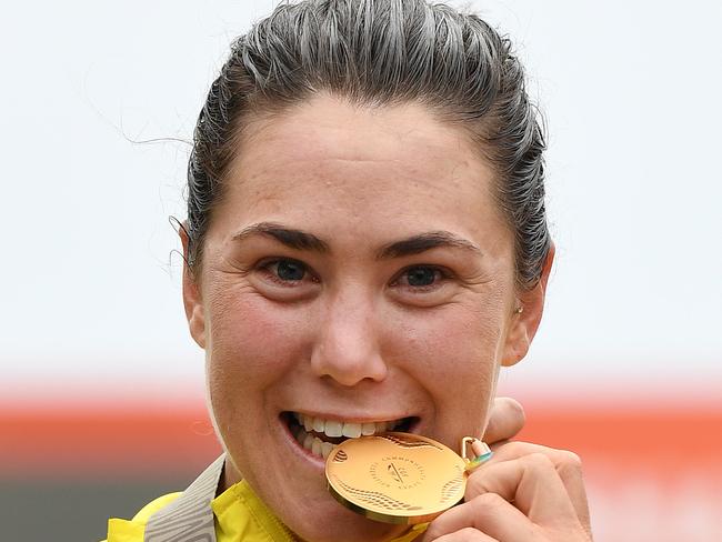 Chloe Hosking of Australia celebrates her gold medal in the women's cycling road race on day ten of the XXI Commonwealth Games on the Gold Coast, Australia, Saturday, April 14, 2018. (AAP Image/Dan Peled) NO ARCHIVING, EDITORIAL USE ONLY