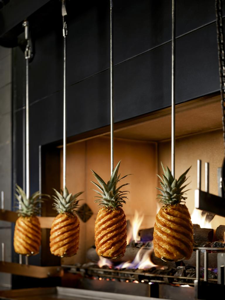 These pineapples are spit roasted for up to five hours and coated with apple caramel every 30 minutes. Picture: Atlantis