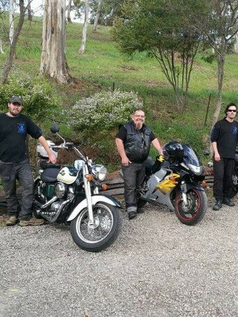 Terry Dycer, centre, with members of his motorcycle club.