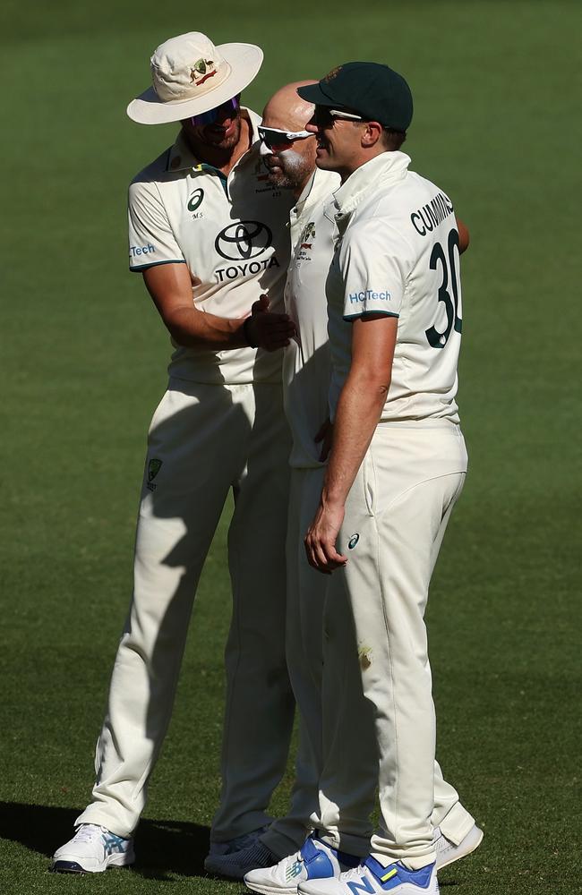 Nathan Lyon celebrates another wicket with Pat Cummins and Mitchell Starc. Picture: Paul Kane/Getty Images