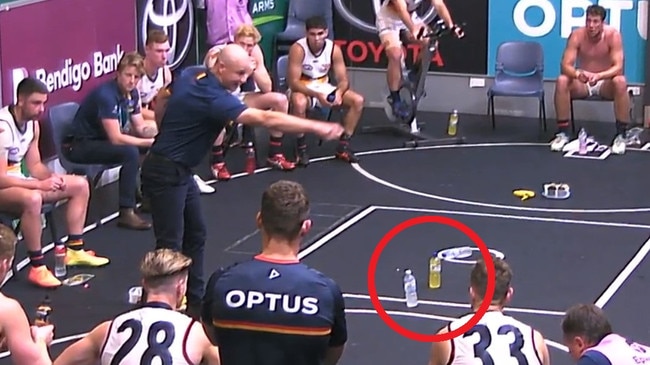 Matthew Nicks uses bottles to show the Crows what to do.