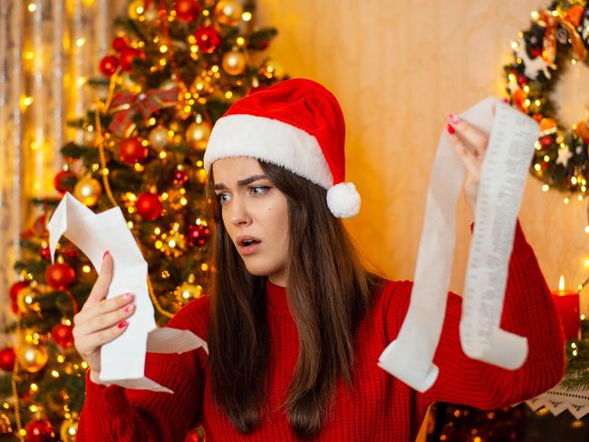 Christmas preparations, concept of much expenses on Christmas presents and decorations; spending surprise shock generic