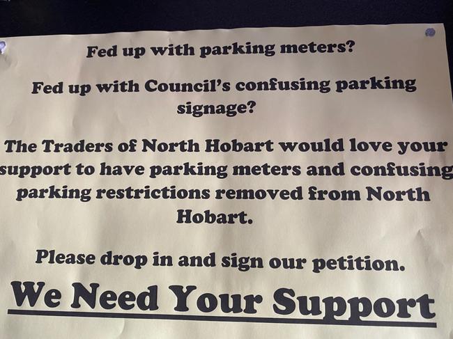 A sign encouraging North Hobart visitors to sign a petition against parking restrictions along the restaurant strip. Source: SUPPLIED.