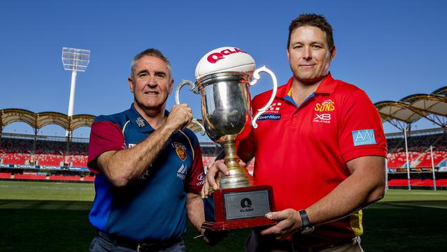 Brisbane Lions coach Chris Fagan and Gold Coast Suns coach Stuart Dew at Metricon Stadium ahead of tonight’s QClash. Picture: Jerad Williams