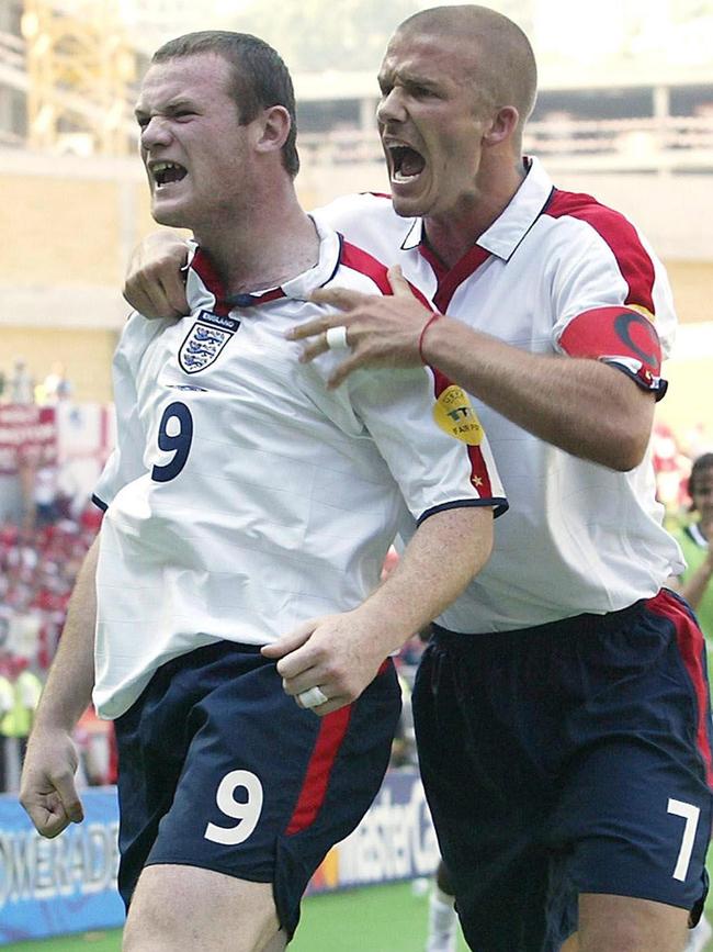 Rooney with David Beckham in 2004.